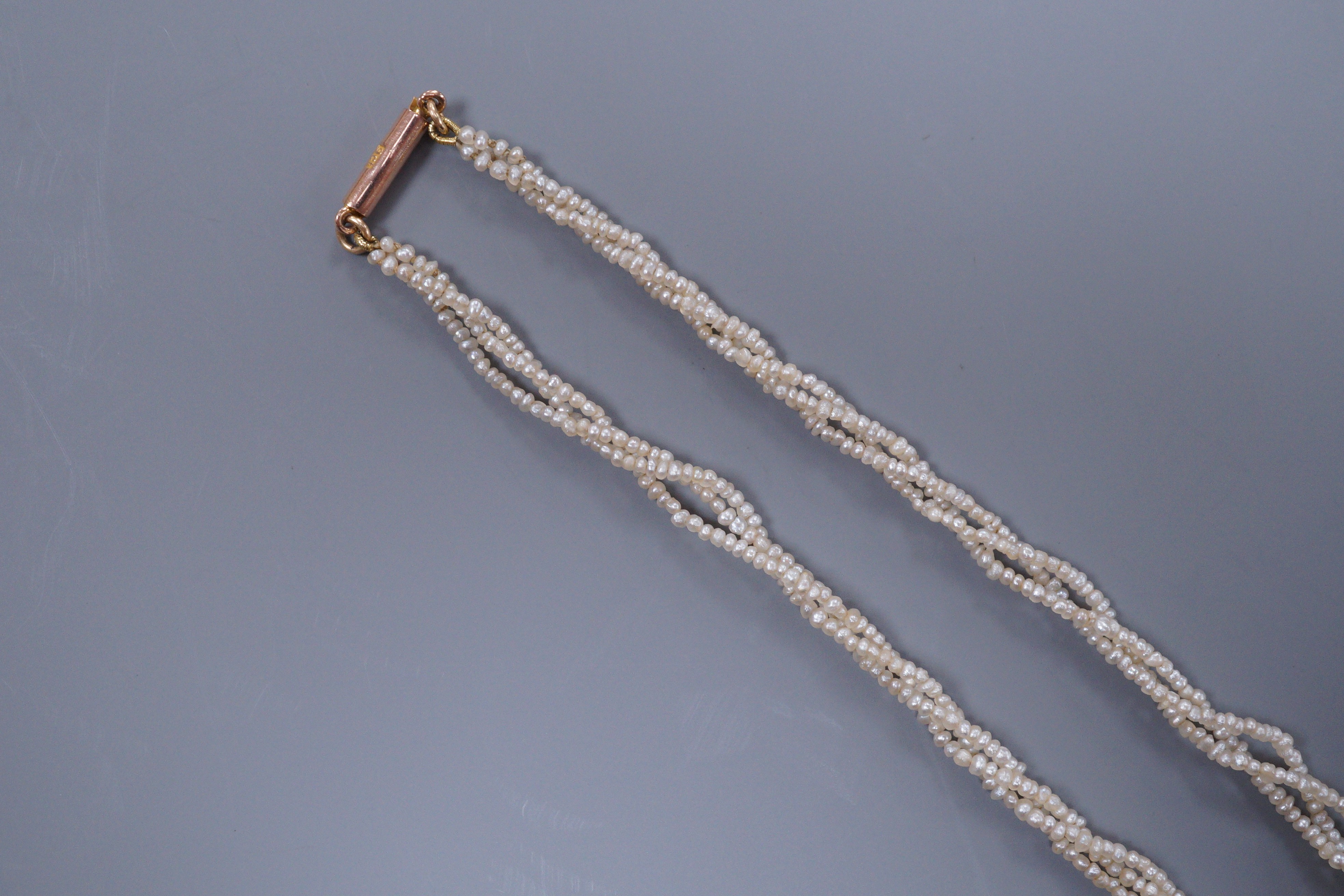 A Victorian triple strand seed pearl necklace, with gold clasp, 42cm